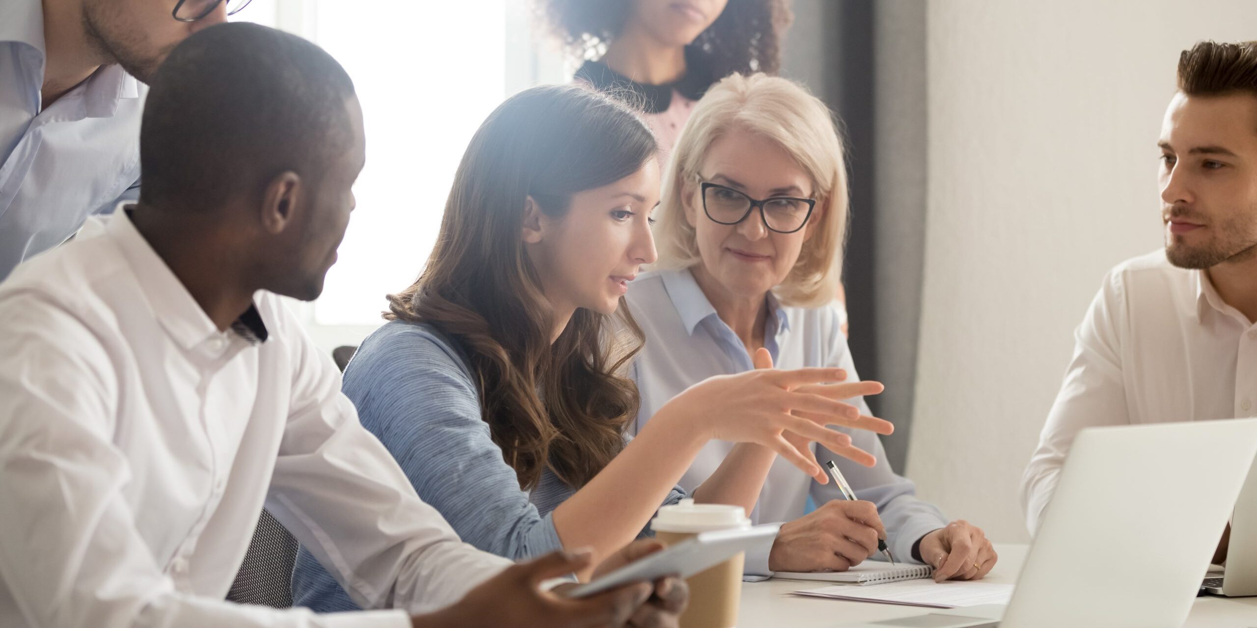 Young female mentor leader coach teaching employees